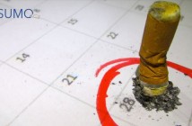 Colilla de cigarro sobre calendario