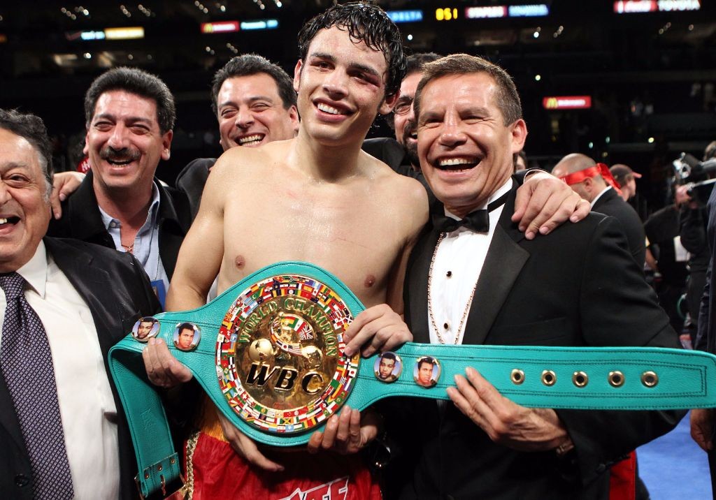 June 4, 2011, Los Angeles,Ca. --- Julio Cesar Chavez Jr.(ctr)poses with his father legendary Julio Cesar Chavez (R)after defeatng Sebastian Zbik by 12-round majority decision to win the WBC World Middleweight title Saturday at Staples Center in Los Angeles. --- Photo Credit : Chris Farina - Top Rank (no other credit allowed) copyright 2011