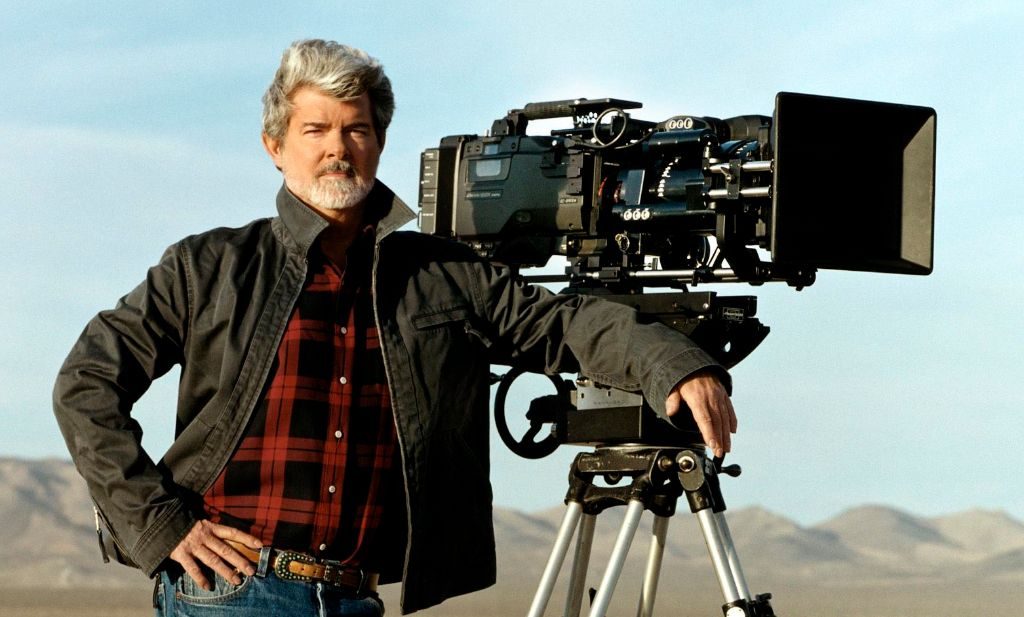 Director George Lucas is shown standing next to a digital movie camera used to shoot, 'Star Wars: Episode II Attack of the Clones,' on the set of the film, in this undated photo. Lucas shot the entire film using digital cameras and hoped to have the film shown with digital projectors in theaters. Studio and theater executives counter that the technology is not ready for mass use and that complex questions remain on setting industry-wide standards, avoiding piracy and financing digital-projection systems, which can cost up to $150,000 for each screen. (AP Photo/Lucasfilm Ltd.)